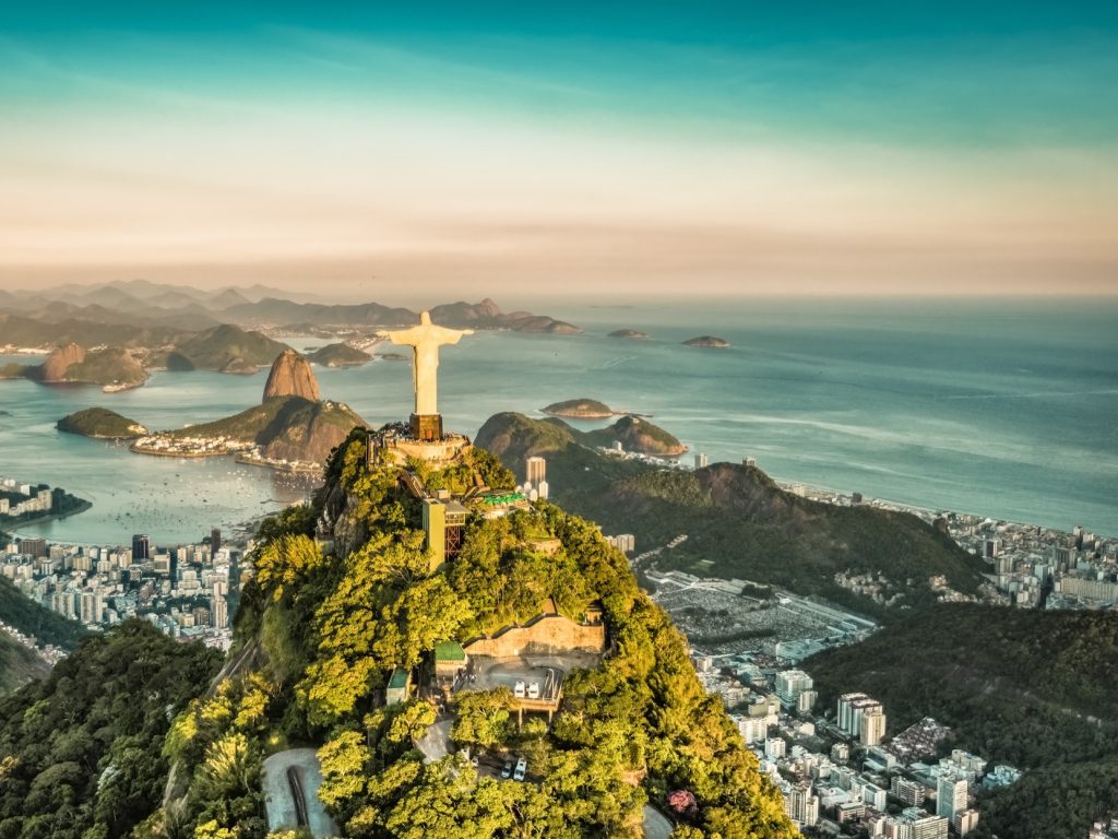 A secluded beach with clear turquoise water and lush tropical vegetation in Brazil